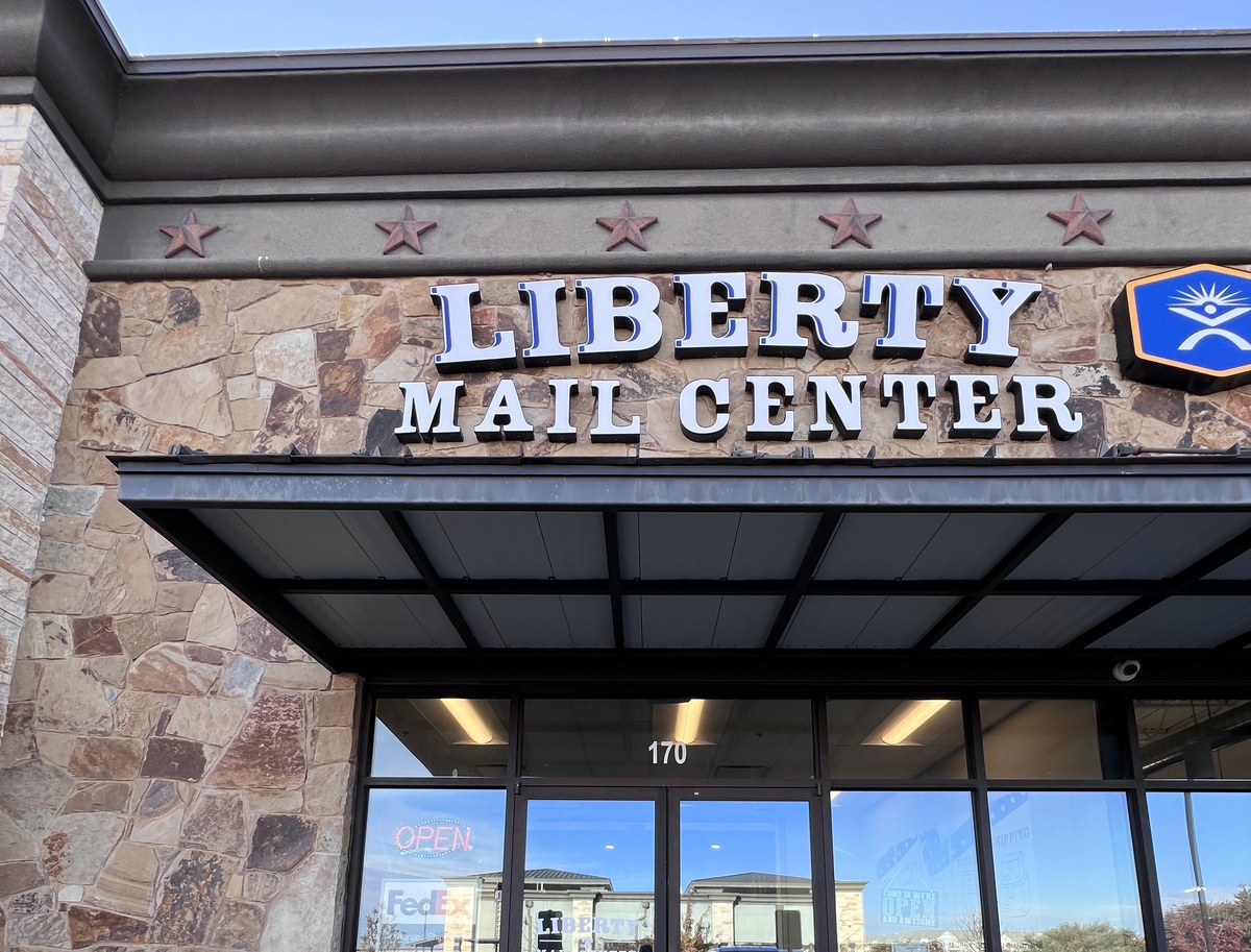 Liberty Mail Center storefront sign on HWY 183 in Leander, Texas